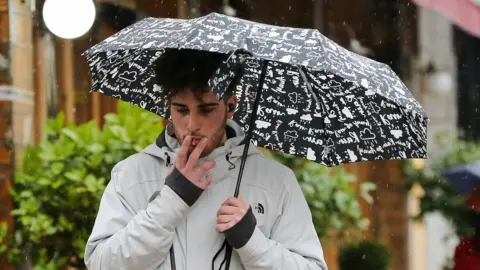 Getty Images A man smoking a cigarette in London