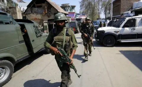 EPA Indian army soldiers patrol during a gun fight with militants in Kachdoora, southern Kashmir
