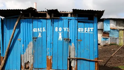 Getty Images A row of pit latrines