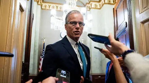 U.S. Senate Majority Leader John Thune (R-SD) speaks with reporters following a Senate Republican luncheon, in the U.S. Capitol on June 27, 2025 in Washington, DC. 