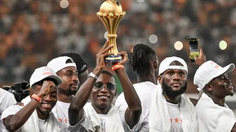 Ivory Coast players celebrate with the trophy after winning the 2023 Africa Cup of nations
