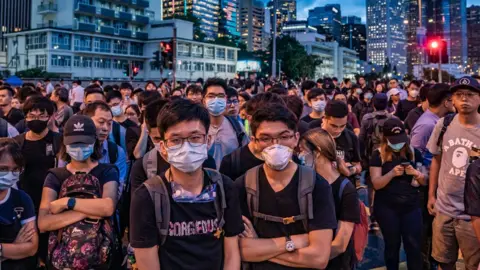 Getty Images Protesters (protestors, demonstrators) occupy a street demanding Hong Kong leader to step down after a rally against the now-suspended extradition bill outside of the Chief Executive Office on June 17, 2019 in Hong Kong China