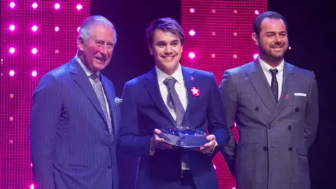 PA Prince Charles, Prince of Wales and Danny Dyer (R) with winner of mentor of the year award, Rahul Mehra