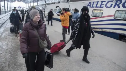 EPA Russians arrive by train in Helsinki - 9 March