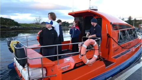 Children taking a boat to school