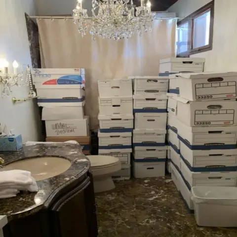 US Department of Justice A photo allegedly shows boxes of classified documents in a bathroom.