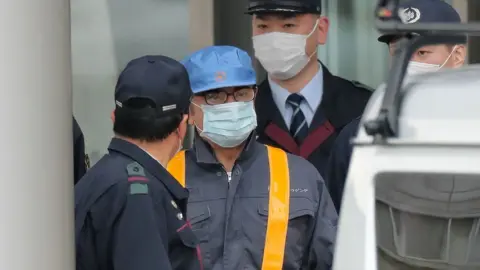 Getty Images Carlos Ghosn leaves prison in disguise in March