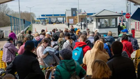 Getty Images Refugees at the border with Moldova in April