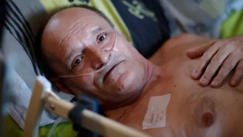 Reuters Alain Cocq lies in bed