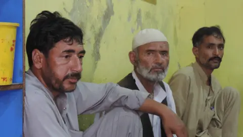 Ghulam Mohammad (left) and Fida Hussain (centre) fled the village of Hargosel