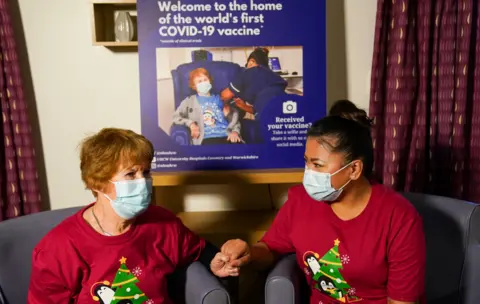 Jacob King/PA Media Margaret Keenan and May Parson