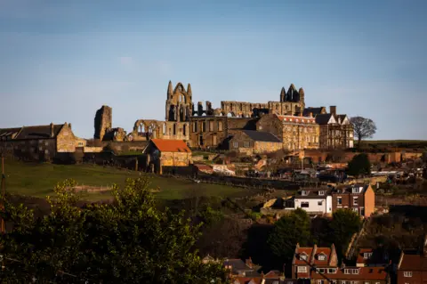 The abbey above the town