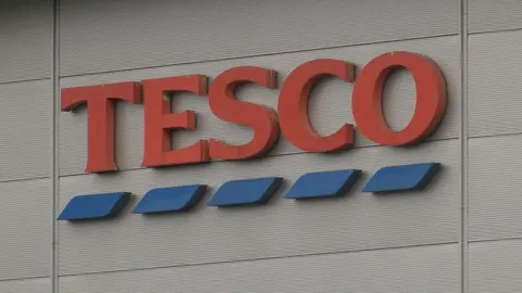 Self-service: Booths supermarket puts staff back behind its tills - BBC News