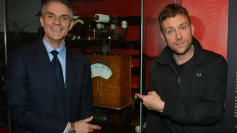 Davie with Blur frontman Damon Albarn in 2012