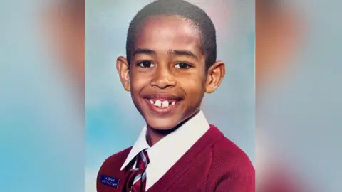 Josh Babarinde Image of Eastbourne MP Josh Babarinde as a child in a school photo