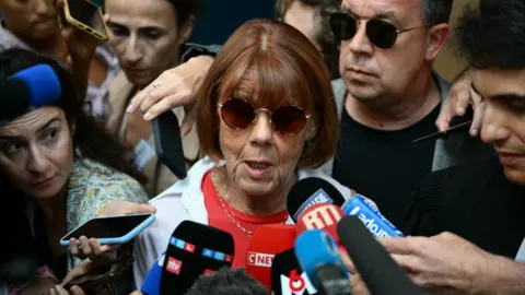 Getty Images Gisele P addresses media as she leaves the courthouse during the trial of her husband accused of drugging her for nearly ten years and inviting strangers to rape her at their home in Mazan, a small town in the south of France, in Avignon, on September 5, 2024. 