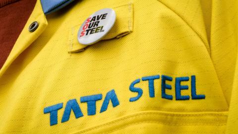 A steelworker wearing a Save our Steel badge
