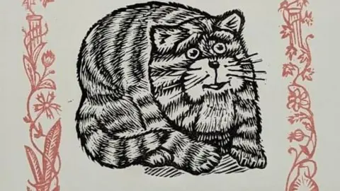 Peter Firmin Partnership A black and white close up linocut image of a smiling Bagpuss