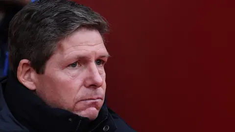 Oliver Glasner puffs out cheeks and looks on in dejected manner