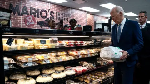 Getty Images US President Joe Biden visits a Las Vegas, Nevada grocery store on Tuesday