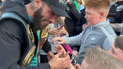 Anthony Cacace greets young fans in west Belfast