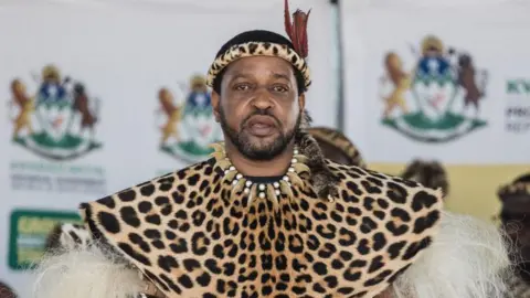 AFP The Zulu king is seen here wearing traditional regalia as he looks on during a government event in South Africa's KwaZulu-Natal province.