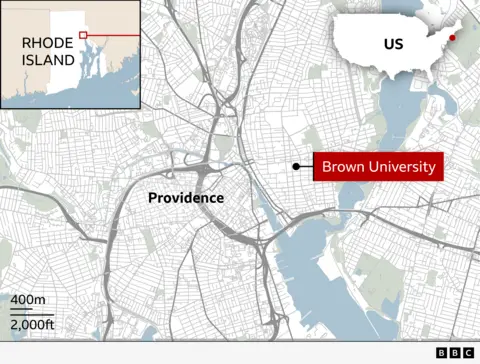 Map showing the location of Brown University in Providence, Rhode Island. The main map highlights streets and waterways in Providence, with Brown University marked by a red label on the east side of the city.