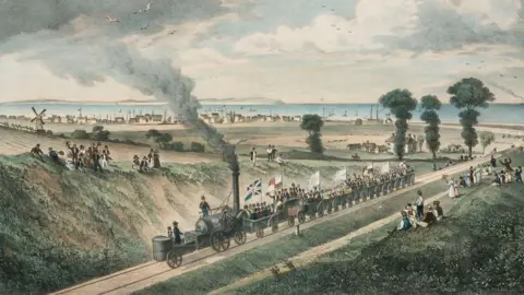 A colour drawing of a 19th Century steam railway with flags and people waving with the sea in the backgorund
