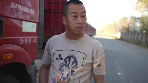 Wang Xiqing/BBC Lorry driver in Heihe