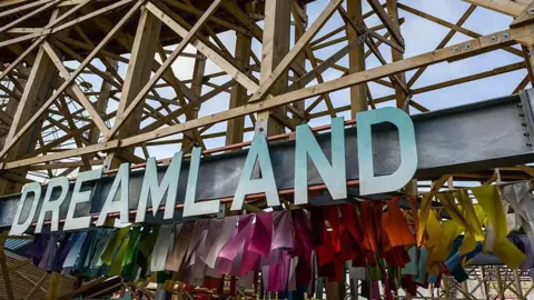 The Dreamland sign below a wooden rollercoaster