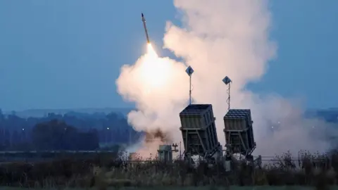 Reuters Israel's Iron Dome air defense battery fires an interceptor missile at a rocket launch from Gaza, in Sderot, Israel, May 10, 2023.