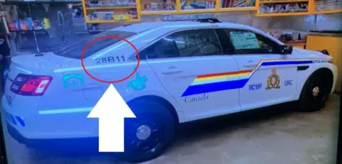 Reuters Police car believed to have been used by a gunman