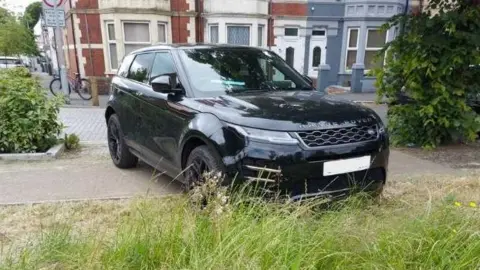 Kate Soper  Car parked on pavement 