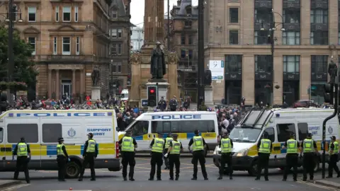 PA Media Protesters at a demonstration in George Square in Glasgow