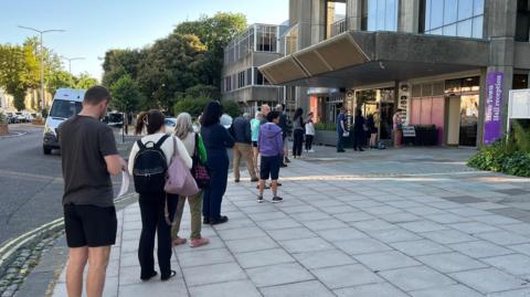 People queueing outside Hove Town Hall