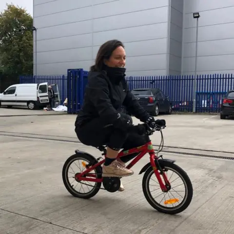 Laura Wilson Laura cycling to work.