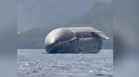 SpaceX rocket floating on the ocean