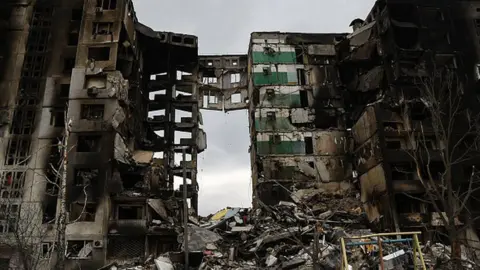 Getty Images Remnants of an apartment building in Borodyanka litter the ground after the Russian invasion of Ukraine.