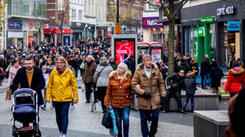 People walking through Liverpool city centre
