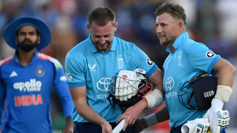 Joe Root smiles after leading England to victory