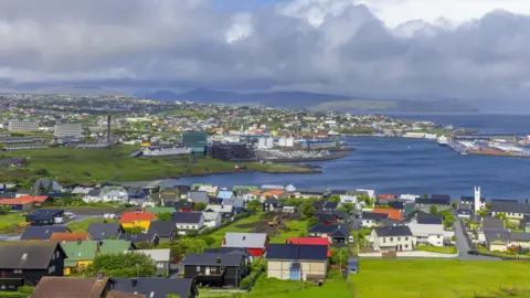 Getty Images Aerial view over the city and harbour of Torshavn, Thorshavn port and marina on the island Streymoy, Faroe Islands.