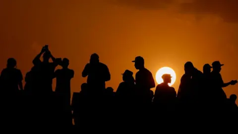 KENZO TRIBOUILLARD/AFP Supporters cheer during the Africa Cup of Nations group C football match between Senegal and Cameroon in Yamoussoukro on 19 January.