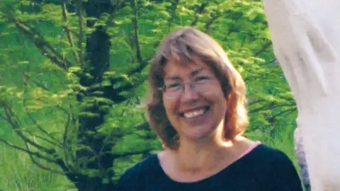 Jane Rickards Jane Rickards smiles in a garden