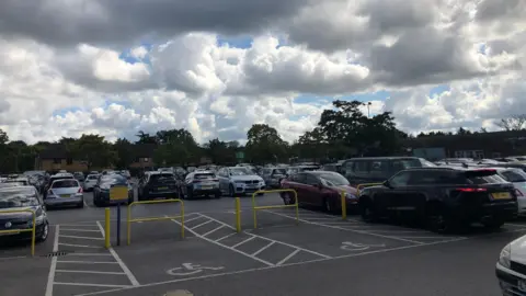 Cars parked at Hersham Green Shopping Centre