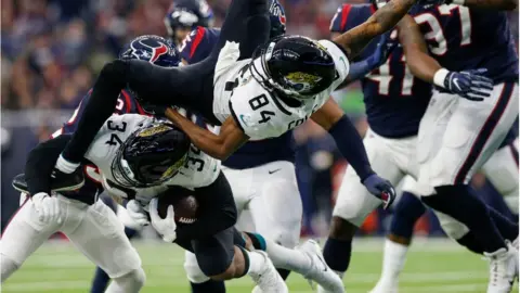 Getty Images Carlos Hyde #34 of the Jacksonville Jaguars collides with Keelan Cole #84 in the fourth quarter against the Houston Texans at NRG Stadium on December 30, 2018 in Houston, Texas.