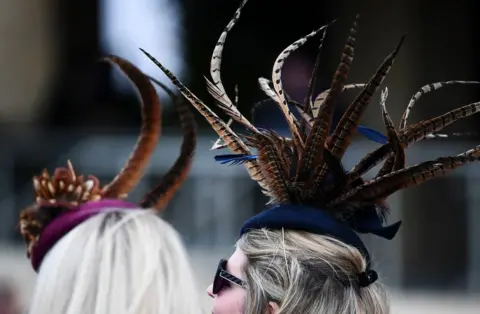 BPI/Shutterstock Racegoers during Ladies Day of the 2019 Cheltenham Festival