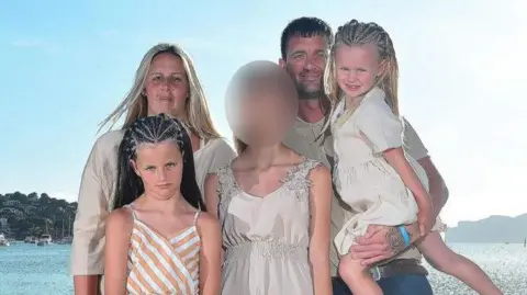 Paul Hepple/GoFundMe Shane Roller and his partner Shannen Morgan with their daughters