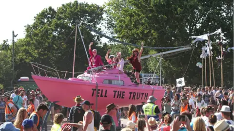 PA Media Extinction Rebellion march at Glastonbury Festival