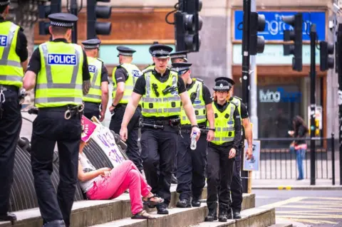 Getty Images Police at climate change protest in Glasgow