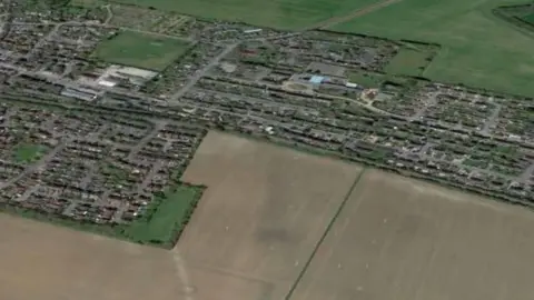 Foreman Homes town layout from above, fields in foreground and background